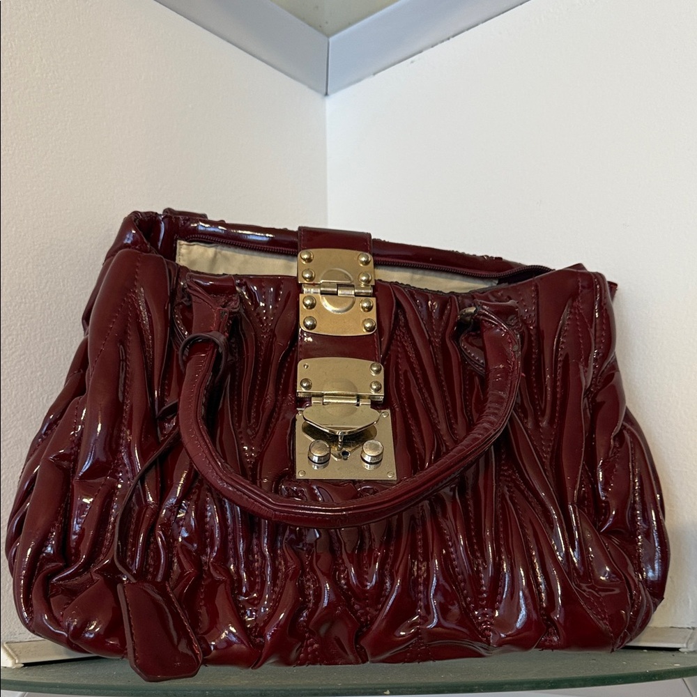 Elegant Burgundy Handbag with Gold Accents
